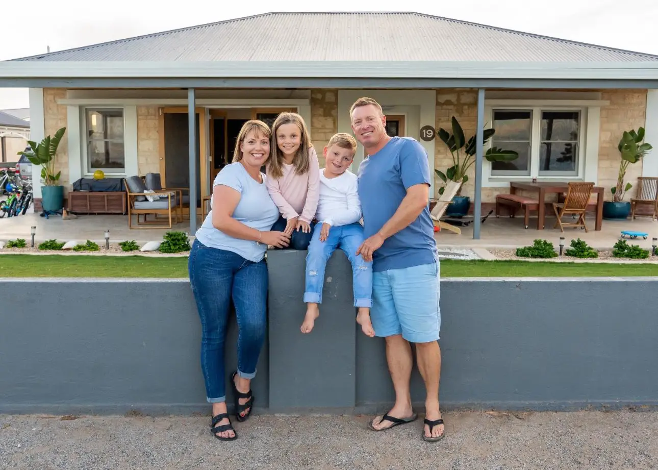A family in front of the home PPR Home Assist placed them in